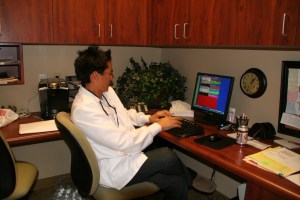 dentist working on computer